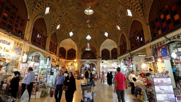 Iranians walk inside Tehran's ancient Grand Bazaar in Tehran on July 28, 2018. (AFP) Iranians walk inside Tehran's ancient Grand Bazaar in Tehran on July 28, 2018. (AFP)