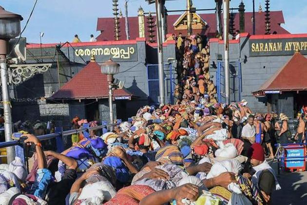 Devotees queue up to enter the Lord Ayyappa temple in Sabarimala, Kerala. The Supreme Court said women have the constitutional right to enter the temple and pray like men without being discriminated against.(PTI File Photo)