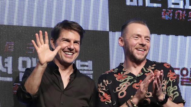 Henry Cavill, director Christopher McQuarrie, actor Tom Cruise and actor Simon Pegg wave to the media after a news conference for their new movie Mission: Impossible - Fallout in Seoul, South Korea.(AP)