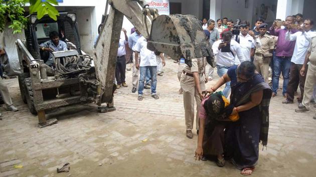 An eye witness shows the spot where a girl was allegedly beaten and killed by a staff member at a state-funded shelter home, in Muzaffarpur. (PTI Photo) An eye witness shows the spot where a girl was allegedly beaten and killed by a staff member at a state-funded shelter home, in Muzaffarpur. (PTI Photo)