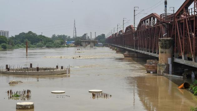 The Yamuna river swells as its water level rises near the Old Bridge, in New Delhi on Sunday, July 29, 2018. (PTI Photo) The Yamuna river swells as its water level rises near the Old Bridge, in New Delhi on Sunday, July 29, 2018. (PTI Photo)