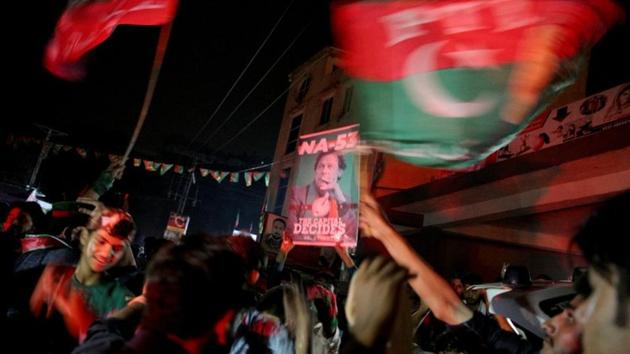 Supporters of Imran Khan, chairman of the Pakistan Tehreek-e-Insaf political party, celebrate near his residence in Bani Gala during the general election, in Islamabad, Pakistan July 25, 2018.(REUTERS Photo)