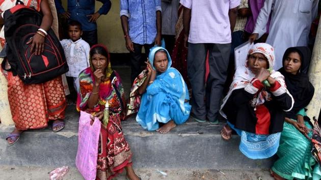 People wait outside a National Register of Citizens centre to get their documents verified by government officials, at Mayong Village in Morigaon district, in Assam, on July 8, 2018. (REUTERS) People wait outside a National Register of Citizens centre to get their documents verified by government officials, at Mayong Village in Morigaon district, in Assam, on July 8, 2018. (REUTERS)