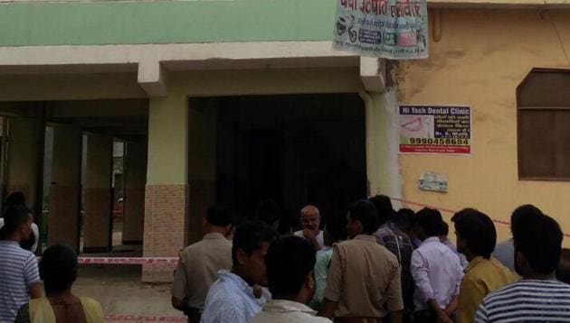 Five families were evacuated after a five-storey building in Greater Noida’s Shahberi village developed cracks and started tilting to one side on Sunday, July 29, 2018.(HT Photo)