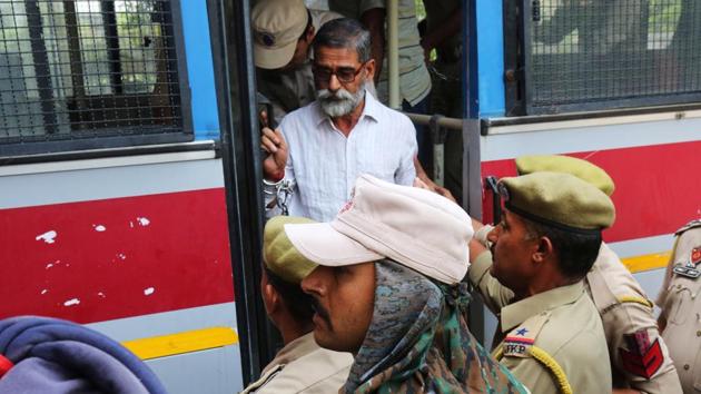 Sanji Ram, one of the eight accused in the rape and murder of an eight-year-old girl in Kathua, arrives for a court appearance in Pathankot, May 31, 2018.(Reuters File Photo)