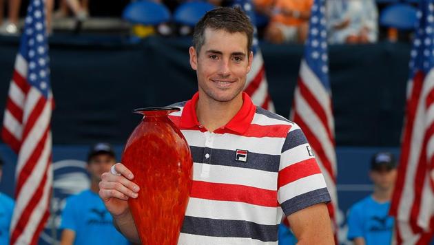 John Isner poses with the trophy after defeating Ryan Harrison during the Atlanta Open final. (AFP) John Isner poses with the trophy after defeating Ryan Harrison during the Atlanta Open final. (AFP)