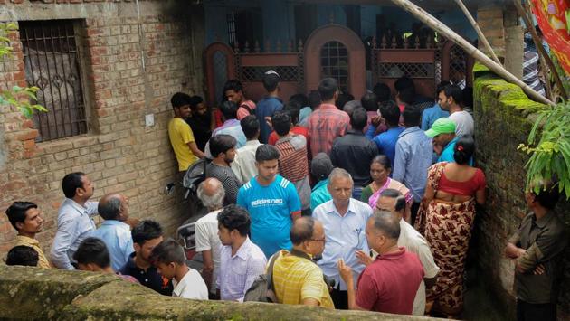 People gather outside the house where seven members of a family allegedly committed suicide, in Ranchi on Monday. Deepak Kumar Jha, working with a leading private company, committed suicide along with his parents, brother, wife and two children, a police officer said. The reason for the suspected suicide is not clear. This is second case of mass deaths in a family in the last 10 days in Jharkhand. (PTI) People gather outside the house where seven members of a family allegedly committed suicide, in Ranchi on Monday. Deepak Kumar Jha, working with a leading private company, committed suicide along with his parents, brother, wife and two children, a police officer said. The reason for the suspected suicide is not clear. This is second case of mass deaths in a family in the last 10 days in Jharkhand. (PTI)