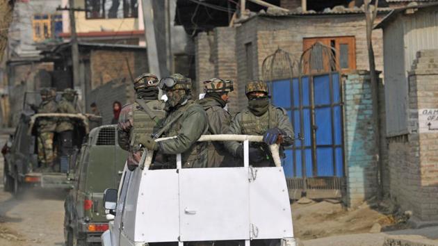 Security personnel patrol at village Barsu in south Kashmir's Pulwama district some 30 kilometers from Srinagar. (HT File Photo)
