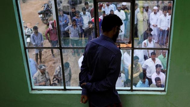 Mohammed Aslam, brother of Mohammed Azam, who was lynched by a mob, looks out of his house as people gather to give their condolences to the family in Hyderabad, India. (REUTERS File Photo) Mohammed Aslam, brother of Mohammed Azam, who was lynched by a mob, looks out of his house as people gather to give their condolences to the family in Hyderabad, India. (REUTERS File Photo)