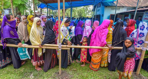 People wait to check their names on the draft of the state's National Register of Citizens after it was released, at a NRC Seva Kendra in Nagaon on Monday, July 30, 2018. (PTI) People wait to check their names on the draft of the state's National Register of Citizens after it was released, at a NRC Seva Kendra in Nagaon on Monday, July 30, 2018. (PTI)