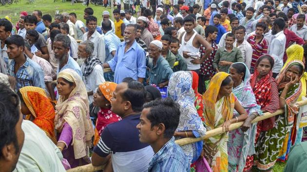 People wait to check their names on the draft of the state's National Register of Citizens after it was released, at an NRC Seva Kendra in Tezpur on Monday, July 30, 2018. (PTI) People wait to check their names on the draft of the state's National Register of Citizens after it was released, at an NRC Seva Kendra in Tezpur on Monday, July 30, 2018. (PTI)