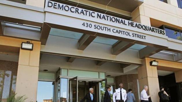 People stand outside the Democratic National Committee headquarters in Washington.(AP File Photo)