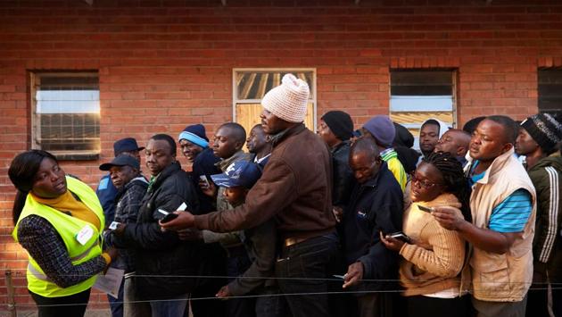 Zimbabwean electoral officials began counting ballots in the first vote of the post-Robert Mugabe era that opinion polls show is too close to call. The front-runners for the presidency are the ruling Zimbabwe African National Union-Patriotic Front’s Emmerson Mnangagwa, 75, Mugabe’s one-time deputy and successor, and his main rival Nelson Chamisa, 40, a lawyer and church pastor who heads the Movement for Democratic Change. (Alex Mcbridge / AFP) Zimbabwean electoral officials began counting ballots in the first vote of the post-Robert Mugabe era that opinion polls show is too close to call. The front-runners for the presidency are the ruling Zimbabwe African National Union-Patriotic Front’s Emmerson Mnangagwa, 75, Mugabe’s one-time deputy and successor, and his main rival Nelson Chamisa, 40, a lawyer and church pastor who heads the Movement for Democratic Change. (Alex Mcbridge / AFP)