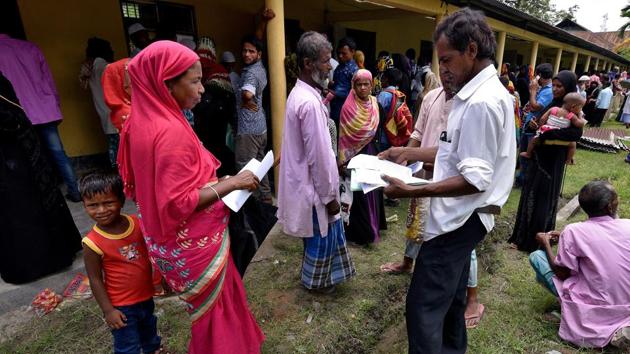 Villagers wait outside the National Register of Citizens (NRC) centre to get their documents verified by government officials, at Mayong Village in Morigaon district, in Assam on July 8. (REUTERS) Villagers wait outside the National Register of Citizens (NRC) centre to get their documents verified by government officials, at Mayong Village in Morigaon district, in Assam on July 8. (REUTERS)