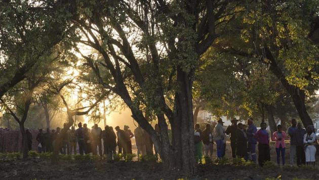 People line up to vote at the Fitchela primary school in Kwekwe, Zimbabwe. Officials overseeing the polls, in which a record number of candidates stood, said many polling stations had queues and estimated that average turnout was around 75 percent by Monday evening. (Jerome Delay / AP) People line up to vote at the Fitchela primary school in Kwekwe, Zimbabwe. Officials overseeing the polls, in which a record number of candidates stood, said many polling stations had queues and estimated that average turnout was around 75 percent by Monday evening. (Jerome Delay / AP)