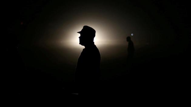 A police officer keeps vigil during the general elections in Harare, Zimbabwe. Mnangagwa was viewed as the frontrunner, although the latest opinion polls showed a tight race. There will be a runoff on Sept. 8 if no candidate wins more than half the votes. (Siphiwe Sibeko / REUTERS) A police officer keeps vigil during the general elections in Harare, Zimbabwe. Mnangagwa was viewed as the frontrunner, although the latest opinion polls showed a tight race. There will be a runoff on Sept. 8 if no candidate wins more than half the votes. (Siphiwe Sibeko / REUTERS)