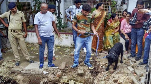 Police with their sniffer dogs investigate the site where a rape victim was allegedly buried, at a government shelter home in Muzaffarpur, on Monday, July 23, 2018. (PTI File Photo) Police with their sniffer dogs investigate the site where a rape victim was allegedly buried, at a government shelter home in Muzaffarpur, on Monday, July 23, 2018. (PTI File Photo)