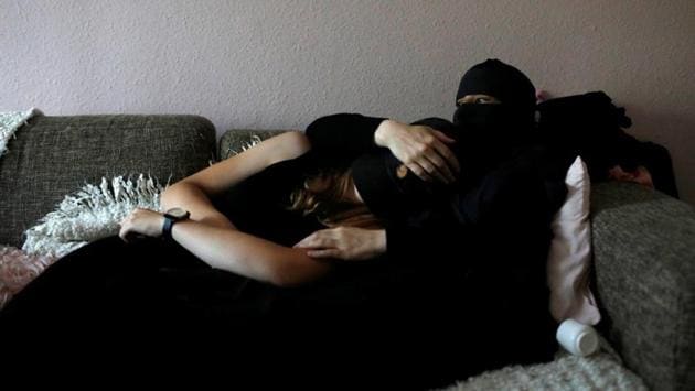 Ayah (R), 37, lays with her daughter at her friend's apartment .“I feel this law legitimises acts of hatred but, on the other hand, I feel people have become more aware of what is going on. I get more smiles on the street and people are asking me more questions,” said Ayah. (Andrew Kelly / Reuters) Ayah (R), 37, lays with her daughter at her friend's apartment .“I feel this law legitimises acts of hatred but, on the other hand, I feel people have become more aware of what is going on. I get more smiles on the street and people are asking me more questions,” said Ayah. (Andrew Kelly / Reuters)