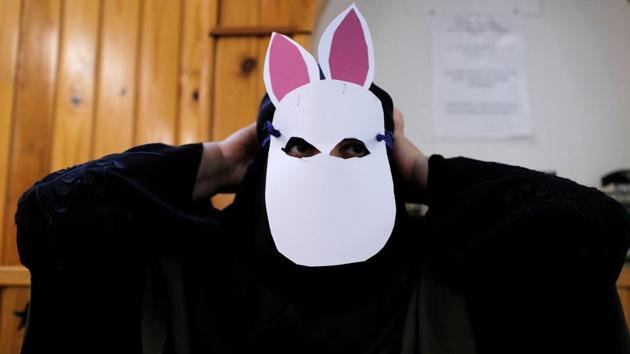 Mona, 55, tests a mask at a workshop during preparation for a protest.Under the law, police will be able to instruct women to remove their veils or order them to leave public areas. Justice Minister Soren Pape Poulsen said officers would fine them and tell them to go home. Fines will range from 1,000 Danish crowns ($160) for a first offence to 10,000 crowns for a fourth violation. (Andrew Kelly / Reuters) Mona, 55, tests a mask at a workshop during preparation for a protest.Under the law, police will be able to instruct women to remove their veils or order them to leave public areas. Justice Minister Soren Pape Poulsen said officers would fine them and tell them to go home. Fines will range from 1,000 Danish crowns ($160) for a first offence to 10,000 crowns for a fourth violation. (Andrew Kelly / Reuters)