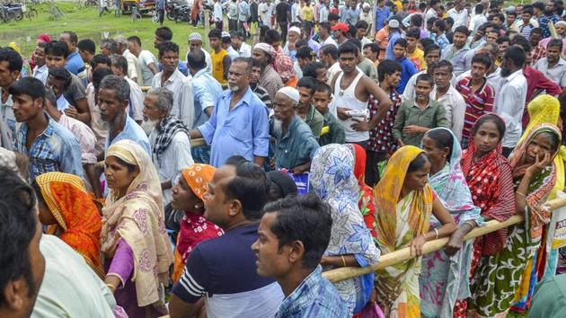 People wait to check their names on the final draft in Tezpur. Registrar General of India Sailesh, who released the draft, said “ample opportunity” would be given to these applicants if they file claims and objections between August 30 and September 28 before the final list is prepared. (PTI)