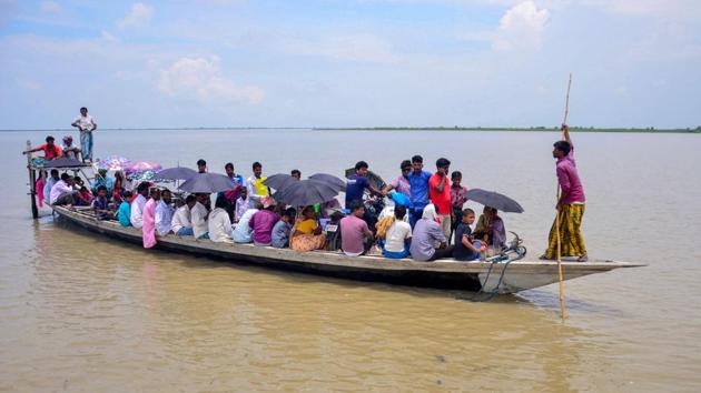 Villagers arrive by boat to check their names in the final draft of the National Register of Citizens (NRC), at a centre at Goroimari on Monday. Amid row over the status of those excluded from the NRC list, the Supreme Court on Tuesday said Assam’s updated National Register of Citizens (NRC) is a draft and “no coercive action” should be taken against people whose names were excluded. (PTI)