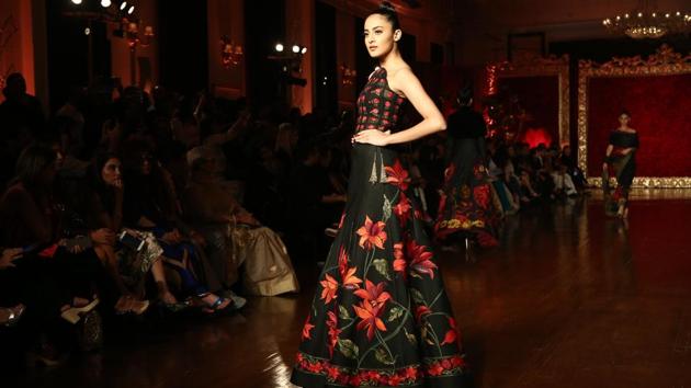 Structured lehengas dripping in rich beaded floral embroidery with sculptural peplums to free-flowing anarkalis with nipped waists and glittering gold embroideries are Bal’s speciality, and with his latest show, the couturier stepped it up a notch in a collection fit for queens and kings. (Amal KS/HT Photo ) 