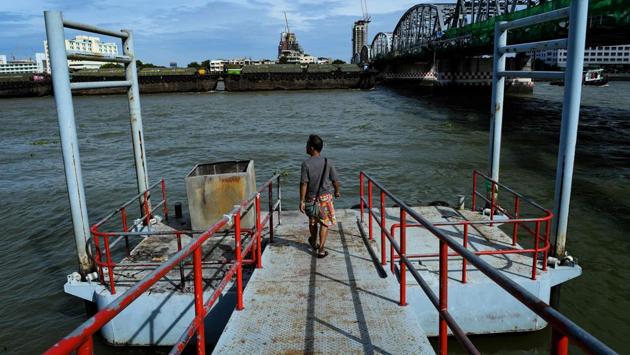 Kneeling before his homemade metal scuba helmet, Bhoomin Samang (pictured) prays for good fortune before he dives into the day’s work -- scouring the bed of Bangkok’s Chao Phraya river for sunken treasure. The 62-year-old is part of a small community known as Thailand’s “Indiana Jones” divers, who brave the inky-black underworld of the trash-filled waterway in search of coins, jewellery and scrap metal. (Sippachai Kunnuwong / AFP)