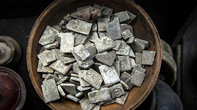 Buddhist stone amulets recovered by divers. Taking artifacts is also technically prohibited and can be punished with fines or jail time. Bhoomin, however, defends the trade, saying divers only go for the small stuff. Then again, the lure of something special is always just around the river bend. (Sippachai Kunnuwong / AFP)