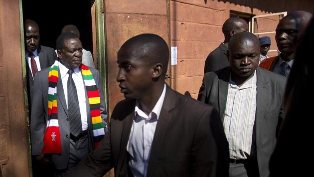 Zimbabwean President Emmerson Mnangagwa leaves the polling station after casting his vote. Mnangagwa said on Tuesday that the ruling party was receiving “extremely positive” information from their representatives. Western diplomats and local observer groups said the race, which saw a turnout of 75 percent, was too close to call. (Jerome Delay / AP) Zimbabwean President Emmerson Mnangagwa leaves the polling station after casting his vote. Mnangagwa said on Tuesday that the ruling party was receiving “extremely positive” information from their representatives. Western diplomats and local observer groups said the race, which saw a turnout of 75 percent, was too close to call. (Jerome Delay / AP)