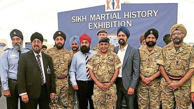 British armed forces Sikhs with UK’s first turbaned Sikh parliamentarian Tanmanjeet Singh Dhesi at the Legacy of Valour Exhibition launch at Khalsa Primary School in Slough, England. (Twitter) British armed forces Sikhs with UK’s first turbaned Sikh parliamentarian Tanmanjeet Singh Dhesi at the Legacy of Valour Exhibition launch at Khalsa Primary School in Slough, England. (Twitter)