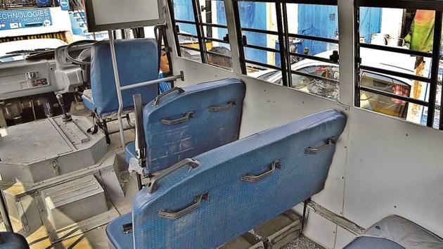 Glass shards scattered on the floor after window panes of the school bus were damaged by a man who hurled stones at the bus in a fit of rage in Ludhiana on Tuesday. (HT Photo) Glass shards scattered on the floor after window panes of the school bus were damaged by a man who hurled stones at the bus in a fit of rage in Ludhiana on Tuesday. (HT Photo)