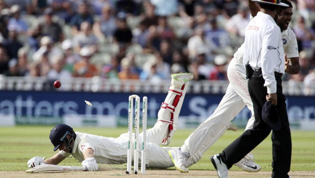 England captain Joe Root is run out after a throw from India captain Virat Kohli on day one of the First Test match at Edgbaston. (AP) England captain Joe Root is run out after a throw from India captain Virat Kohli on day one of the First Test match at Edgbaston. (AP)