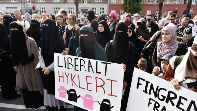 Women wearing niqab to veil their faces take part in a demonstration on August 1, 2018, the first day of the implementation of the Danish face veil ban, in Copenhagen, Denmark. (AFP) Women wearing niqab to veil their faces take part in a demonstration on August 1, 2018, the first day of the implementation of the Danish face veil ban, in Copenhagen, Denmark. (AFP)