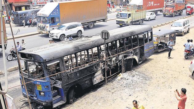 A bus burnt in Chakan after a Maratha stir turned violent on Tuesday.(HT Photo) A bus burnt in Chakan after a Maratha stir turned violent on Tuesday.(HT Photo)