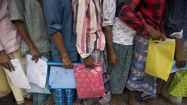 People queue up to check if their names are included in the National Register of Citizens in Bur Gaon village, Assam. (AP Photo) People queue up to check if their names are included in the National Register of Citizens in Bur Gaon village, Assam. (AP Photo)