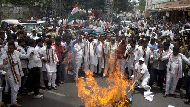 Congress party activists burn an effigy of Prime Minister Narendra Modi and shout slogans accusing the government of buying 36 Rafael fighter aircrafts from France at a highly inflated price during a protest in Hyderabad on Wednesday. (Mahesh Kumar A / AP) Congress party activists burn an effigy of Prime Minister Narendra Modi and shout slogans accusing the government of buying 36 Rafael fighter aircrafts from France at a highly inflated price during a protest in Hyderabad on Wednesday. (Mahesh Kumar A / AP)