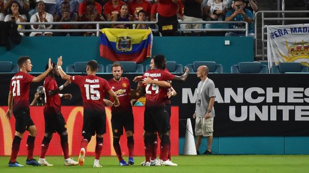 Manchester United teammates celebrate the goal of forward Alexis Sanchez (7) against Real Madrid during the first half of an International Champions Cup soccer match at Hard Rock Stadium.(USA TODAY Sports)