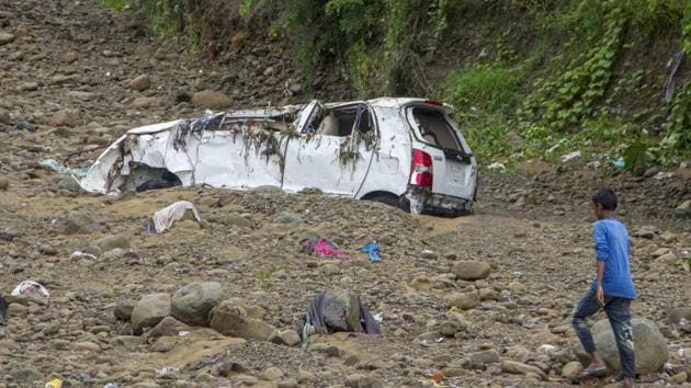 A boy walks past a car that was washed away after the area was lashed by incessant rains and flood situation, in Haldwani on July 31. (File/PTI) A boy walks past a car that was washed away after the area was lashed by incessant rains and flood situation, in Haldwani on July 31. (File/PTI)