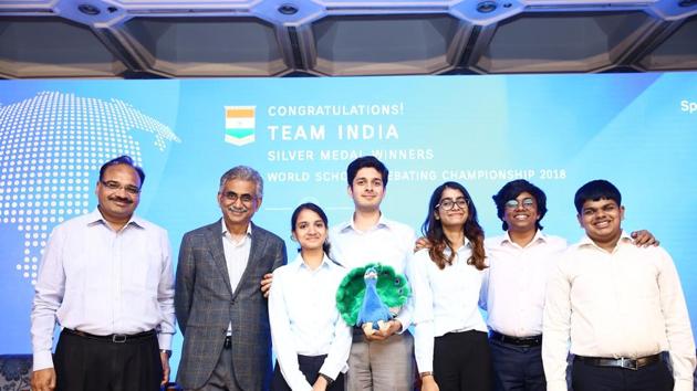 Tamil Nadu school education secretary Pradeep Yadav, Ramco group, chairman, Venketrama Raja and Team India members who won the silver medal in World Schools Debating Championship 2018 pose during a felicitation program in Chennai. (HT Photo) Tamil Nadu school education secretary Pradeep Yadav, Ramco group, chairman, Venketrama Raja and Team India members who won the silver medal in World Schools Debating Championship 2018 pose during a felicitation program in Chennai. (HT Photo)