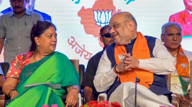 Bhartiya Janta Party President Amit Shah with Rajasthan Chief Minister Vasundhara Raje during the closing ceremony of state working committee meeting, in Jaipur.(PTI Photo)