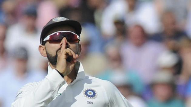 Indian cricket captain Virat Kohli celebrates the dismissal of England's cricket captain Joe Root during the first day of the first test cricket match between England and India at Edgbaston. (AP)