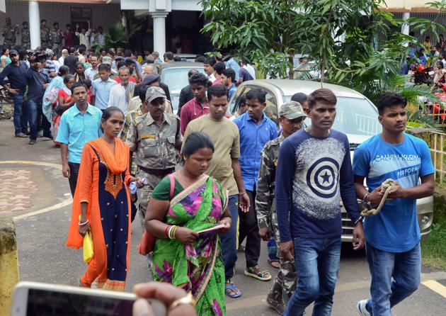 Police take away some of the convicts after they were sentenced life term by a court for lynching five women in a case of witch hunting at Mandar block in 2016, in Ranchi on Thursday, August 2, 2018.(PTI)