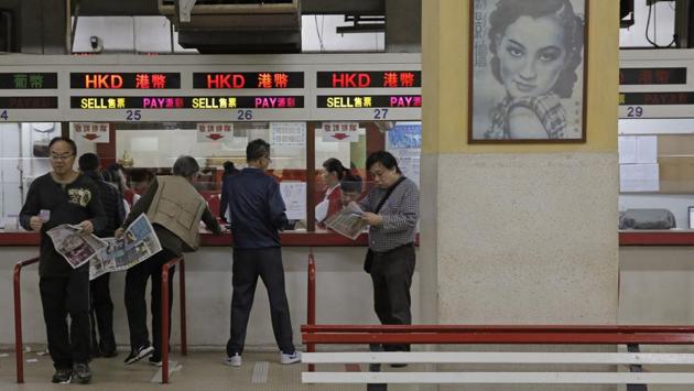 Gamblers place bets on races. The company said many greyhounds retire in peace after their racing life ends after three or four years of competition. But animal rights groups have long accused the club of mistreating dogs and euthanising underperformers or older racers, and campaigned for the club’s closure. (Kin Cheung / AP) Gamblers place bets on races. The company said many greyhounds retire in peace after their racing life ends after three or four years of competition. But animal rights groups have long accused the club of mistreating dogs and euthanising underperformers or older racers, and campaigned for the club’s closure. (Kin Cheung / AP)