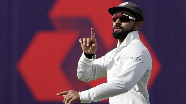 India's captain Virat Kohli celebrates taking the wicket of England's Joe Root on the first day of the first Test cricket match between England and India at Edgbaston in Birmingham, central England on August 1, 2018.(AFP)