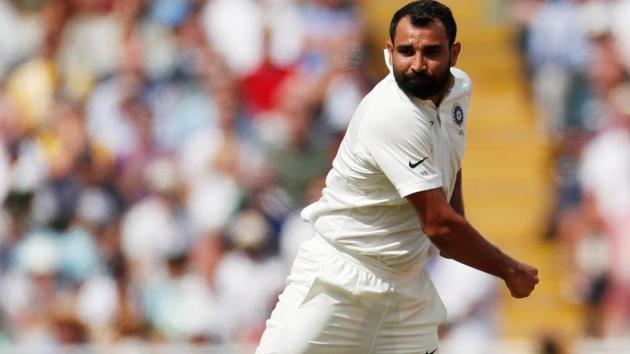 India's Mohammed Shami celebrates after taking the wicket of England's Dawid Malan.(Action Images via Reuters)