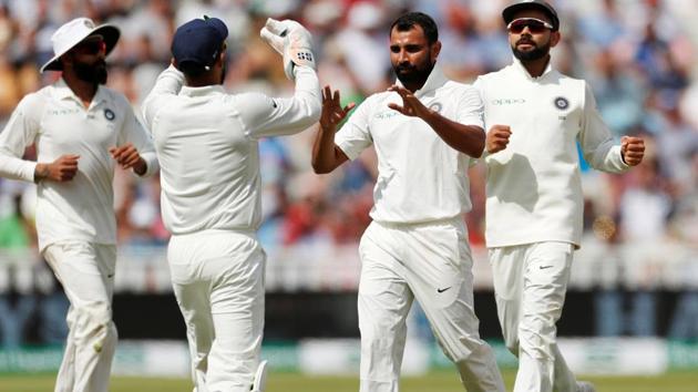 India's Mohammed Shami celebrates after taking the wicket of England's Dawid Malan. (Action Images via Reuters)