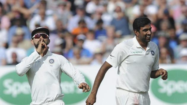 Indian cricket captain Virat Kohli, left, and Ravichandran Ashwin celebrate the dismissal of England's cricket captain Joe Root during the first day of the first test cricket match between England and India at Edgbaston.(AP)