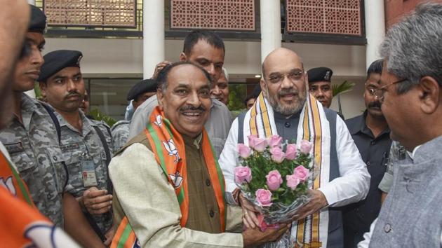 BJP president Amit Shah is greeted by a party leader after a bill to provide constitutional status to the National Commission for Backward Classes was passed by the Lok Sabha on Thursday.(PTI) BJP president Amit Shah is greeted by a party leader after a bill to provide constitutional status to the National Commission for Backward Classes was passed by the Lok Sabha on Thursday.(PTI)