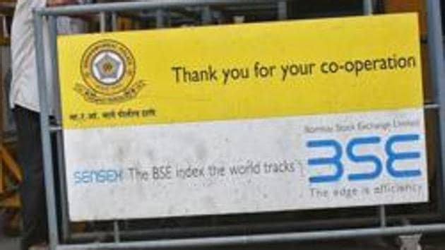 A man looks at a screen across the road displaying the Sensex on the facade of the Bombay Stock Exchange (BSE) building in Mumbai. (Reuters File Photo) A man looks at a screen across the road displaying the Sensex on the facade of the Bombay Stock Exchange (BSE) building in Mumbai. (Reuters File Photo)