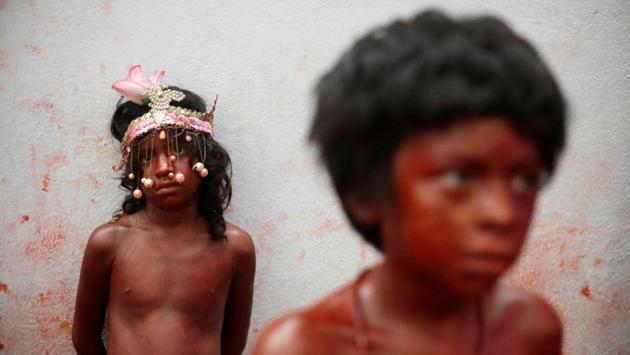 Children are painted in red as part of the festivities in honour of Managua’s patron saint Santo Domingo de Guzman in Managua, Nicaragua. (Jorge Cabrera / REUTERS) Children are painted in red as part of the festivities in honour of Managua’s patron saint Santo Domingo de Guzman in Managua, Nicaragua. (Jorge Cabrera / REUTERS)